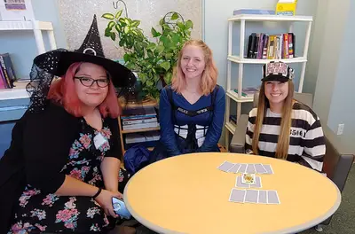 Girls playing cards in the festival fall