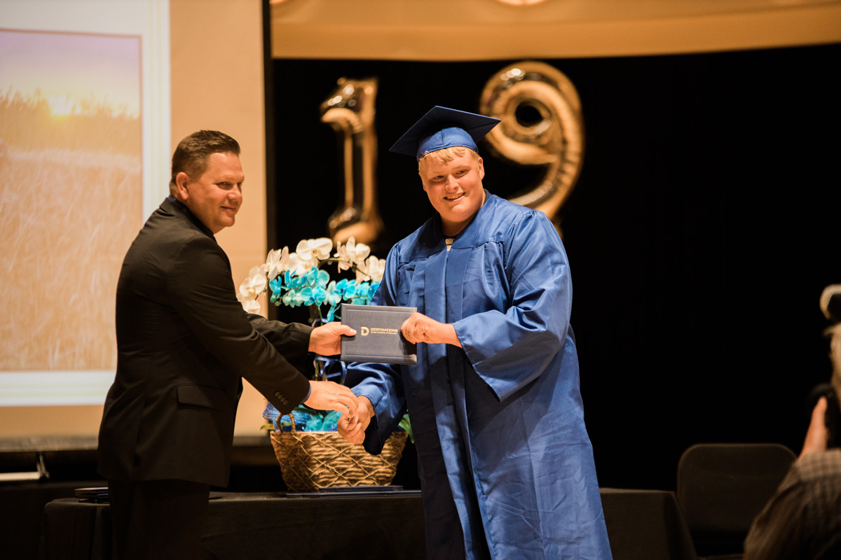 Student receiving gift at graduation