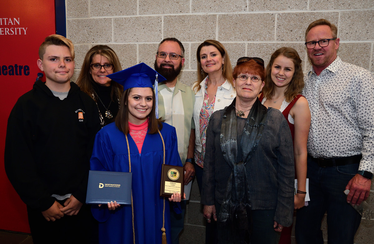 Student with her family in the graduation