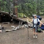Sarah Brekke outside in a forest camping.